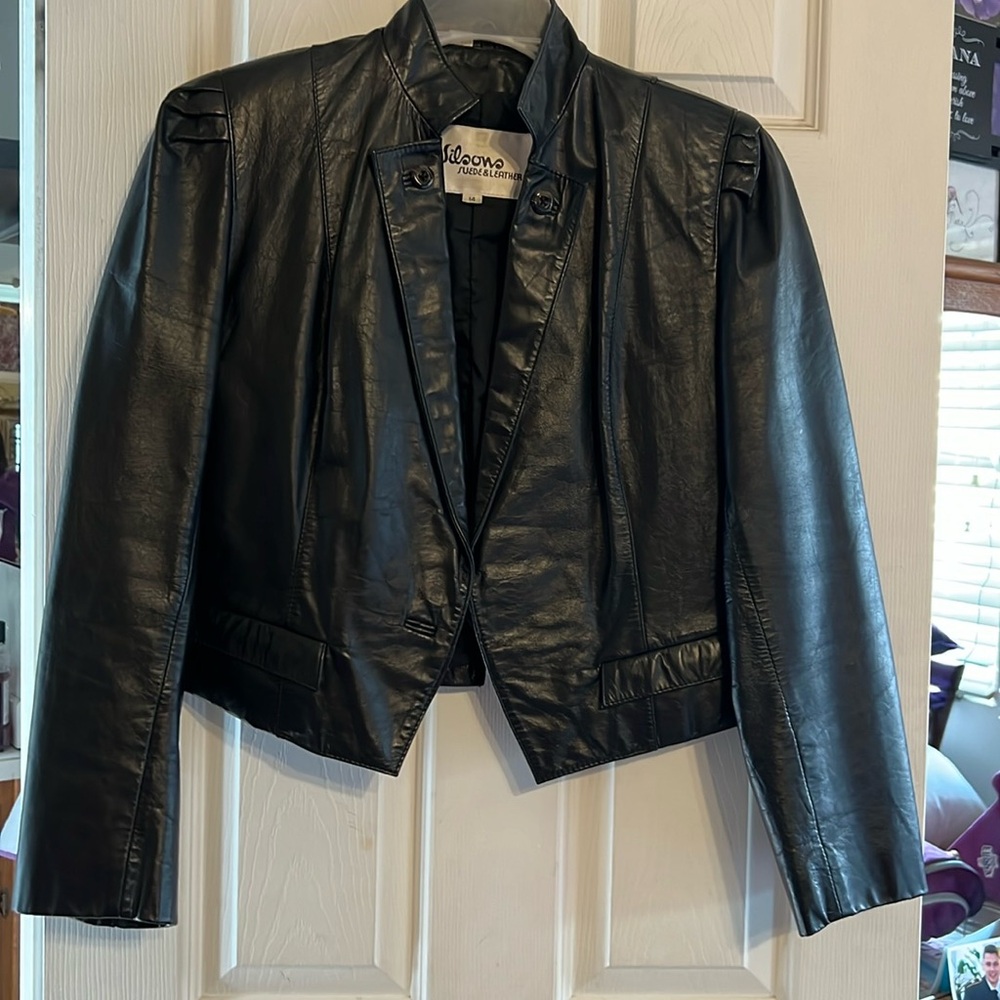 Women’s size 14 waist length, leather jacket, black.